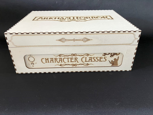 Natural wooden card storage box engraved with the Arkham Horror The Card Game logo on the lid and Character Classes on side