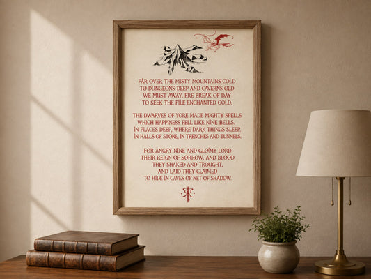 Oak framed print of the Far Over the Misty Mountains Cold verses in red, under a mountain and dragon, on a cream wall