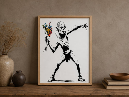 Oak framed street art print of a gaunt creature throwing a colourful bouquet, on a shelf beside vases and books