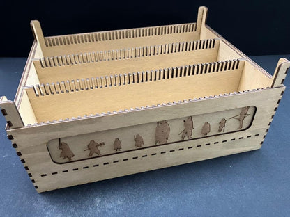 Natural wooden card storage extender with three divided rows, side engraved with a line of fellowship character silhouettes