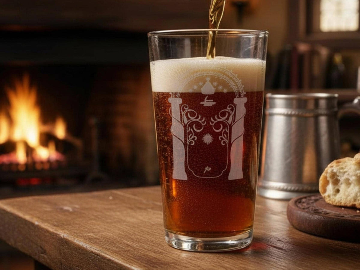 Pint of ale engraved with the Gate of Moria archway and pillars, on a wooden table beside a roaring fire and pewter tankard