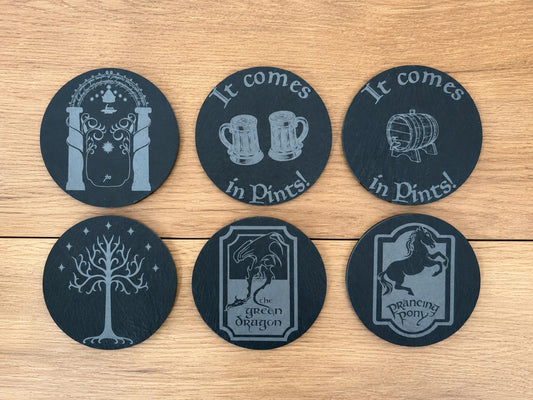 Six round slate coasters engraved with Moria gate, It comes in Pints, White Tree, Green Dragon and Prancing Pony