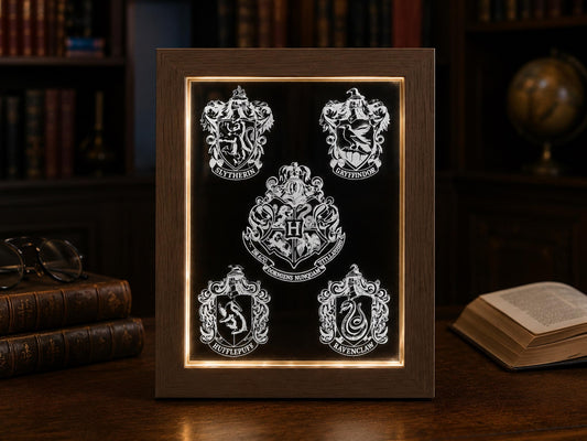 Light oak LED frame glowing with the Hogwarts crest and four house shields engraved on acrylic, among old books