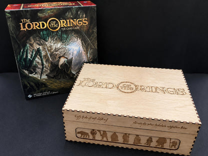 Natural wooden card storage box engraved with The Lord of the Rings title and character silhouettes, beside the card game box