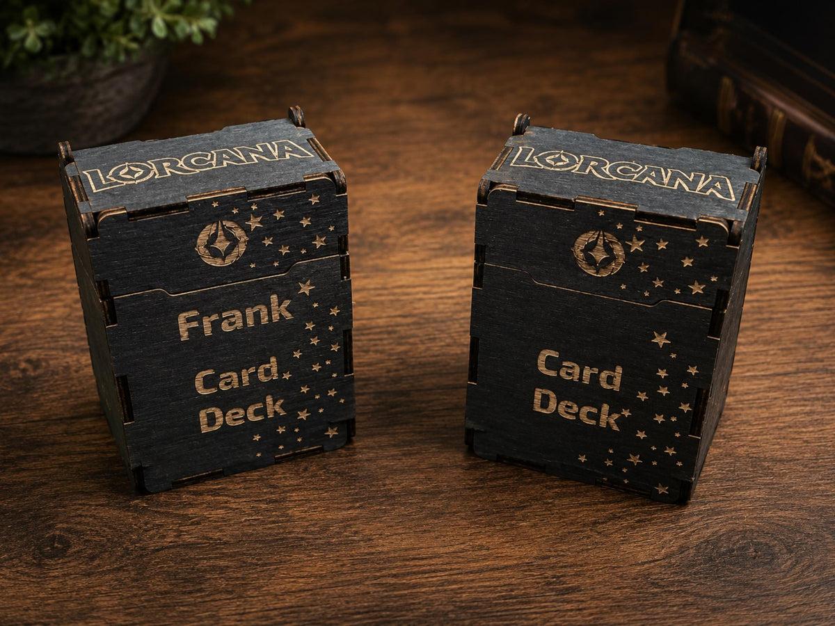 Two black wooden deck boxes engraved with the Lorcana logo, stars and Card Deck, one personalised with the name Frank