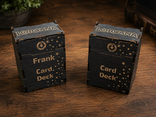 Two black wooden deck boxes engraved with the Lorcana logo, stars and Card Deck, one personalised with the name Frank